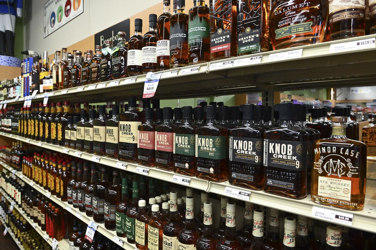 Bourbon bottles sit on the shelves at an ABC store in Dulles, Va. Highly sought-after bottles can fetch as much as 10 times the shelf price on the black market.  (Ricky Carioti/Washington Post)