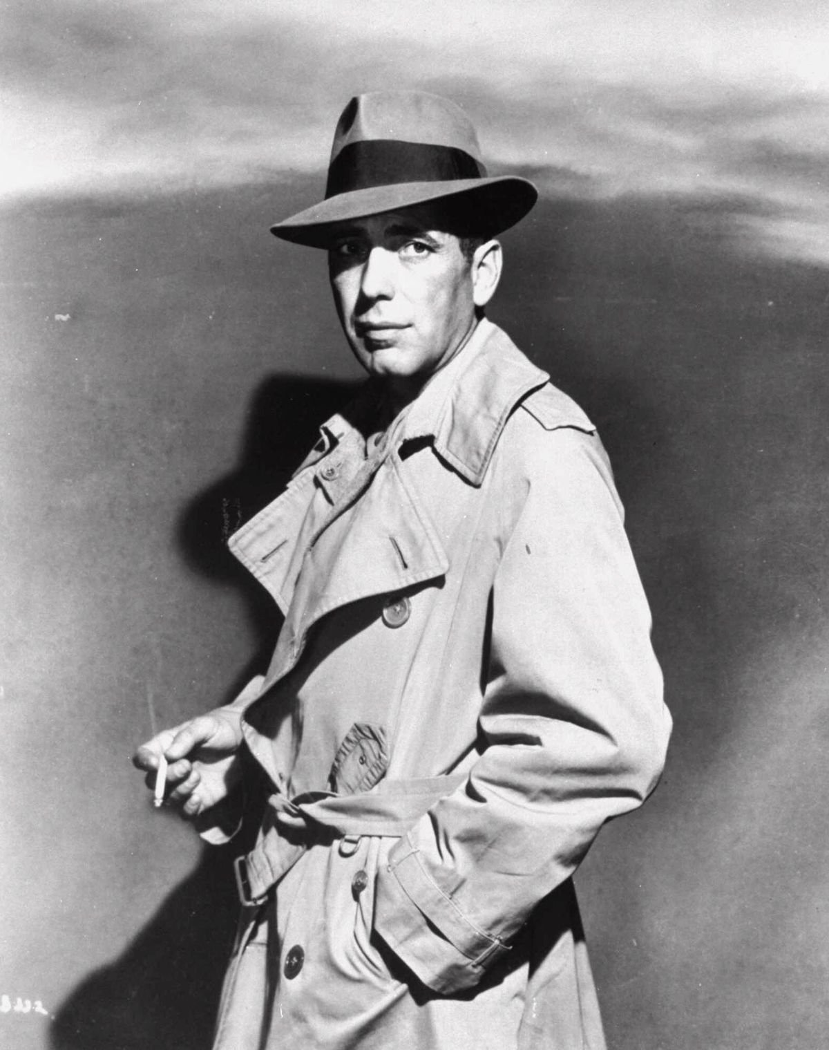 Humphrey Bogart is shown smoking as private eye Sam Spade in a publicity photo for John Huston’s 1941 film “The Maltese Falcon.” Smoking in the movies may not be as glamorous as Bogie once made it, but a new study says filmland smoking still softens the real-life health threat to young fans.  (Associated Press)