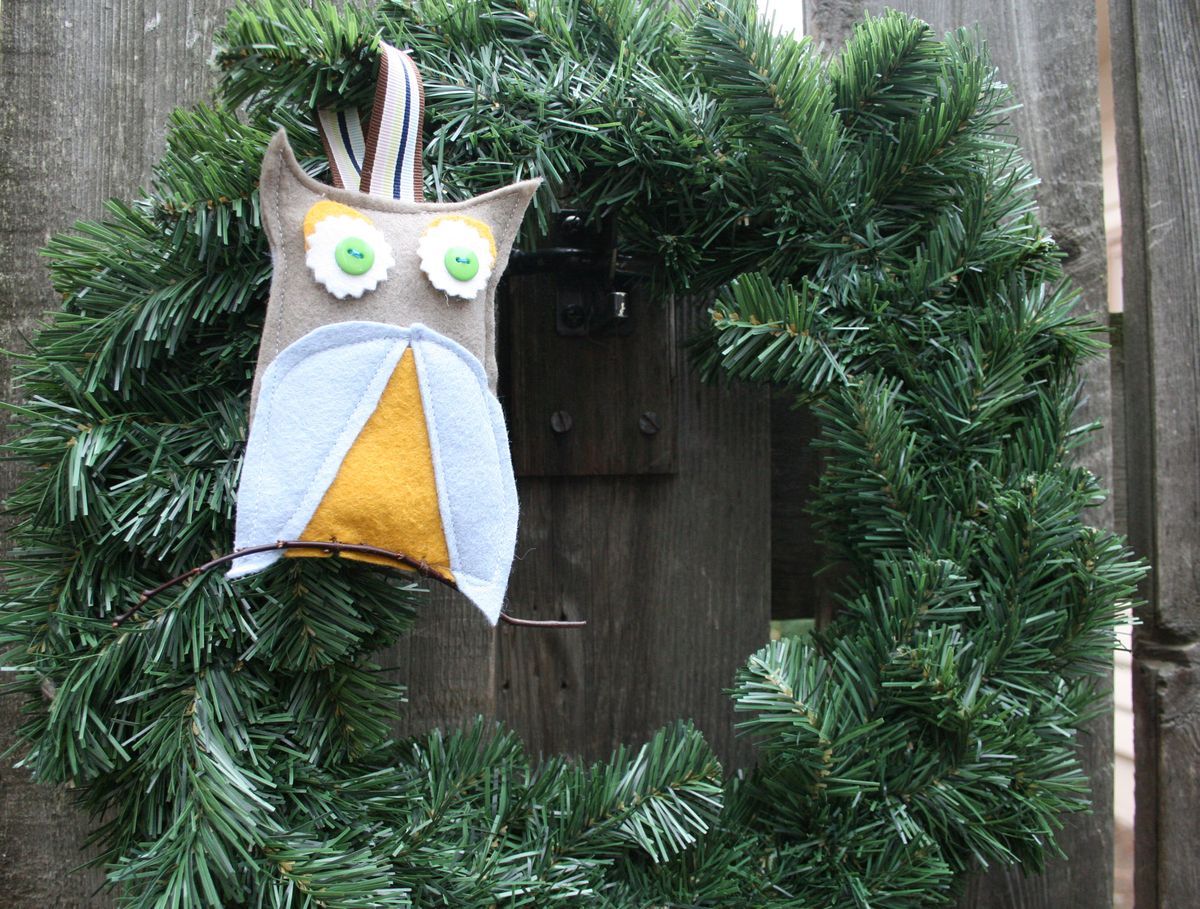 Making ornaments doesn’t have to be complicated or expensive. This owl only required some scrap felt, a couple of buttons, a bit of stuffing and a twig from the yard. Special to  (Photos by Megan Cooley Special to / The Spokesman-Review)