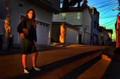 
Meghan Duron, 14, with a basketball outside her home in Manhattan Beach, Calif. She got toxic shock syndrome last September and became critically ill.
 (Los Angeles Times / The Spokesman-Review)