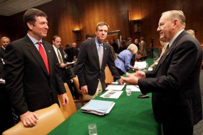
Former Congressman James V. Hansen, R-Utah, right, a member of the Base Realignment and Closure Commission, speaks with Sen. George Allen, R-Va., and Gov. Mark Warner, D-Va., before the start of their testimony before the BRAC Commission at the Senate Dirksen Office building on Capitol Hill, Saturday. 
 (Associated Press / The Spokesman-Review)