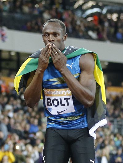 Jamaica's Usain Bolt celebrates after winning the 100 meters on Friday during the Diamond League meet in London. (Associated Press)