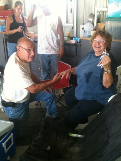 Larry McCracken, left, proposes to his wife, Patti, in Yarnell, Ariz., with her wedding ring, found by one of their daughters in the rubble where their house stood. (Associated Press)