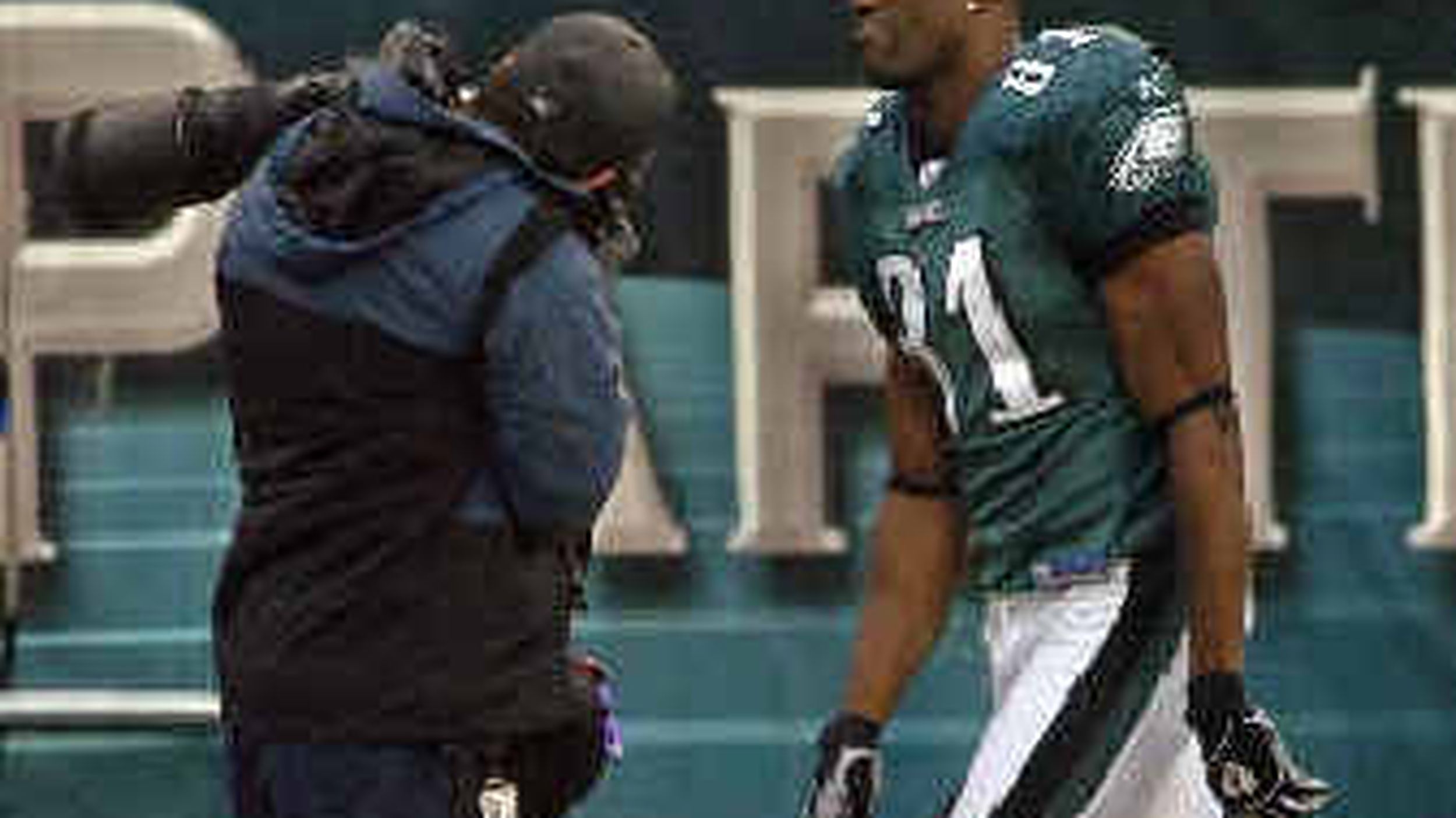 Philadephia Eagles Donovan McNabb talks with wide receiver Terrell