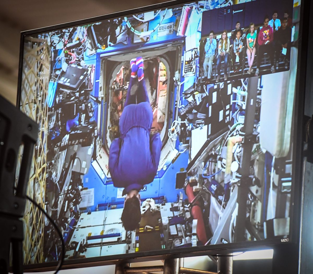 Astronaut Anne McClain executes a front roll in the weightlessness of space aboard the space station on May 15, 2019, during the closing of a video downlink to area students watching at Gonzaga Prep. (Spokesman-Review photo archives)