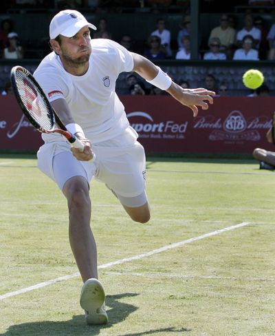American Mardy Fish returns the ball to Olivier Rochus of Belgium in the final match of the Hall of Fame Tennis Championships. (Associated Press)
