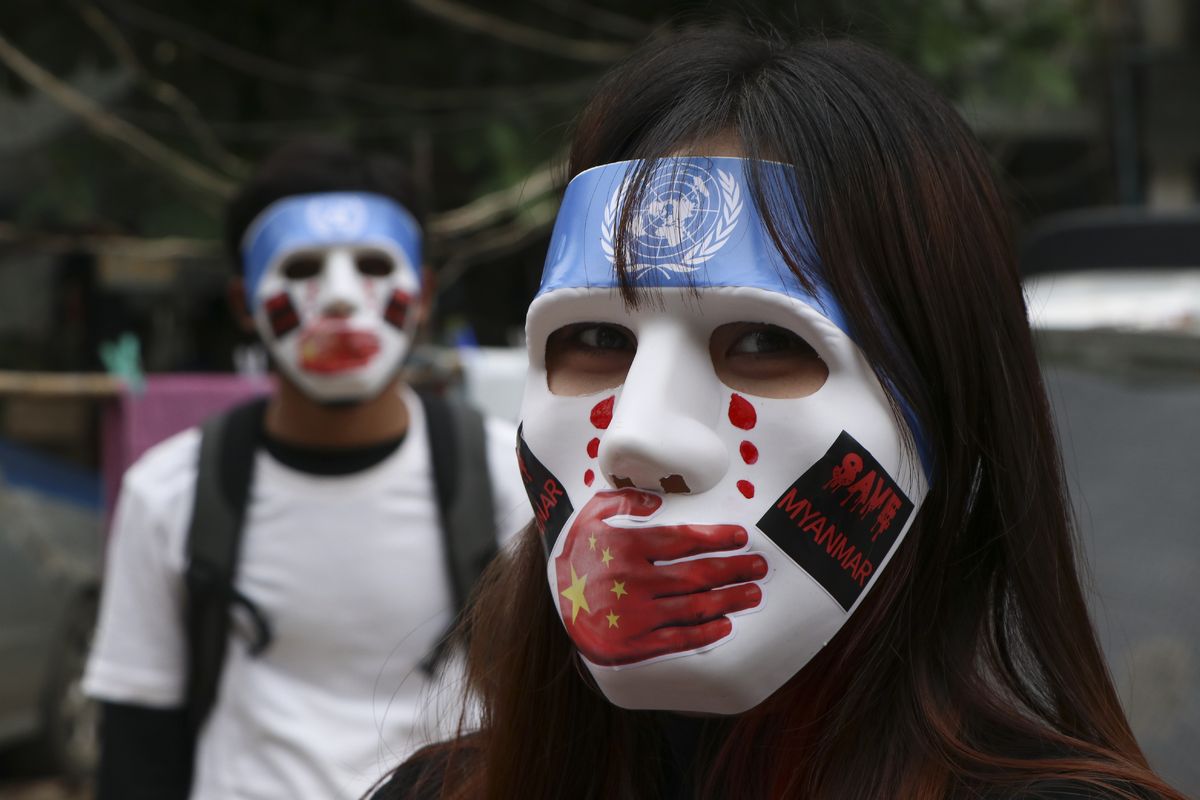 FILE - A young demonstrators participate in an anti-coup mask strike in Yangon, Myanmar, on April 4, 2021. Years after coming under scrutiny for contributing to ethnic and religious violence in Myanmar, internal documents viewed by The Associated Press show that Facebook continues to have problems detecting and moderating hate speech and misinformation on its platform in the Southeast Asian nation.  (STR)