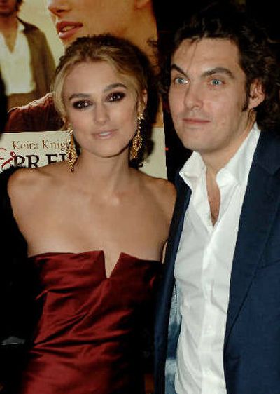 
Actress Keira Knightley, left, and director Joe Wright, pose for photographers upon arriving for the premiere of 
