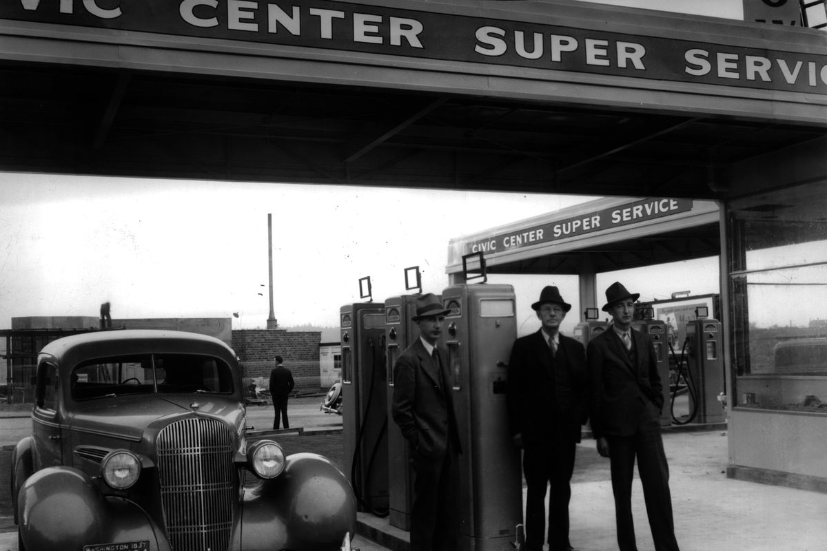 1937: Cecil True, left, vice president of True’s Oil Company; Burt True, president; and Lorenzo True, treasurer, stand at the company’s new station near Main Avenue and Monroe Street. Cecil and Lorenzo, Burt’s nephews, all worked for True’s Oil Company, which was founded by Burt’s father in 1900. The pioneering oil company built some of the first gas stations in the region.  (The Spokesman-Review Photo Archive)