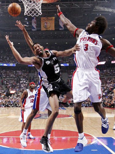 
Detroit's Ben Wallace, right, disrupts a shot attempt by San Antonio's Robert Horry during first-quarter action in Game 3 of the NBA Finals.
 (Associated Press / The Spokesman-Review)