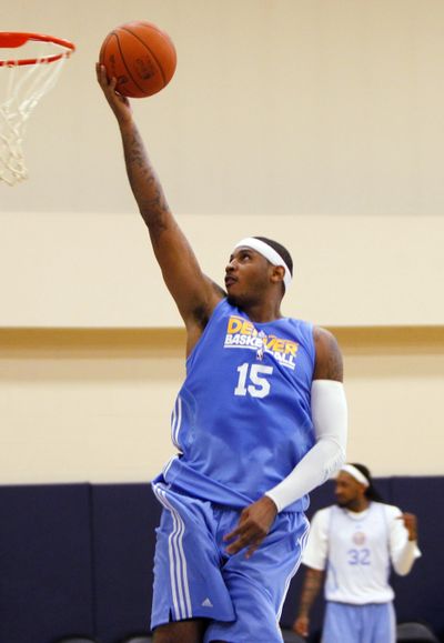 Denver’s Carmelo Anthony remains professional amid trade talks.  (Associated Press)