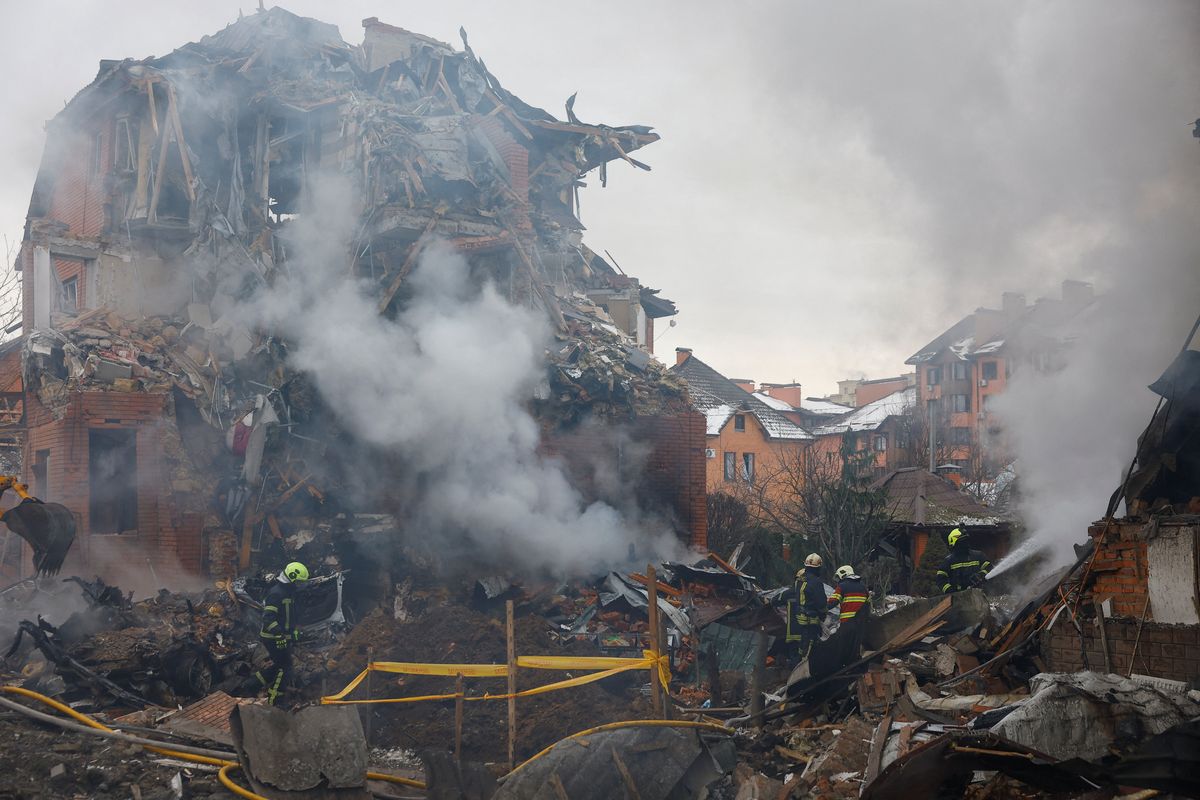 Firefighters work at the site of a residential building damaged during Russian drone and missile strikes, amid Russia