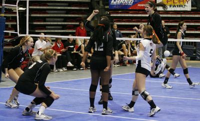 The Lewis and Clark Tigers celebrate after winning the State 4A title Saturday by beating Kamiakin in Kennewick.Special for  (KAI-HUEI YAU Special for / The Spokesman-Review)