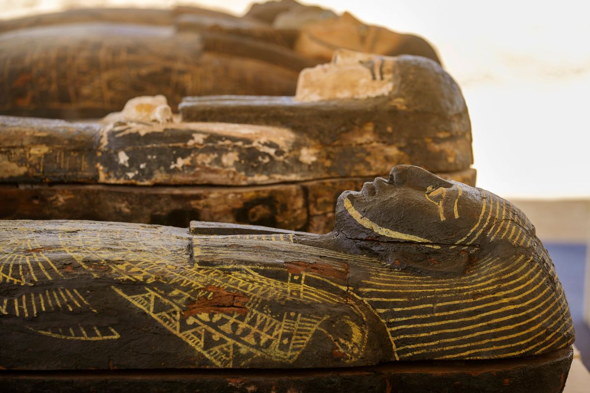 Painted coffins with well-preserved mummies inside, dating back to the Late Period of ancient Egypt around 500 B.C, are displayed at a makeshift exhibit at the feet of the Step Pyramid of Djoser in Saqqara, 24 kilometers (15 miles) southwest of Cairo, Egypt, on Monday  (Amr Nabil)
