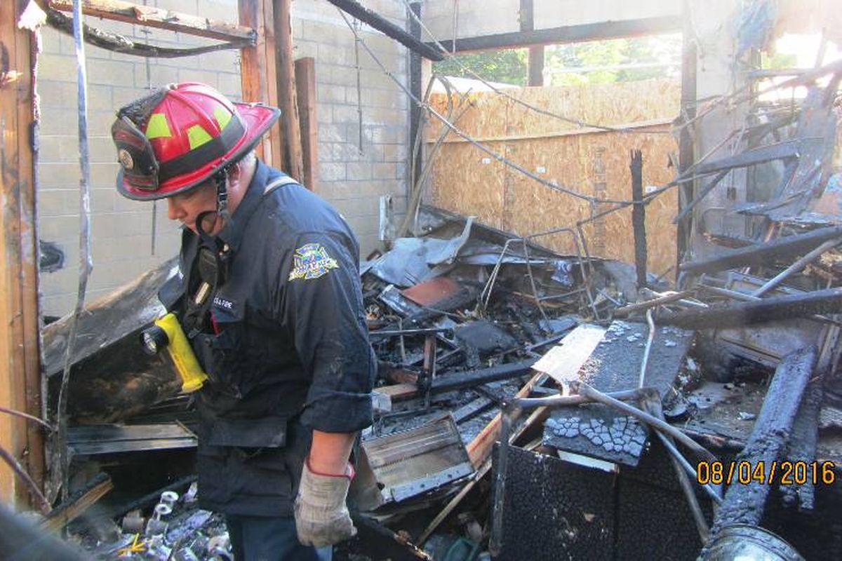 Fire Investigator Bobby Gonder working to determine the area of origin Thursday morning. (Coeur d'Alene Fire Department photo)
