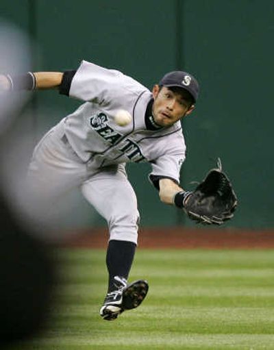 
Seattle center fielder Ichiro Suzuki makes a running catch on Jhonny Peralta's fly in the fourth inning Thursday night. Associated Press
 (Associated Press / The Spokesman-Review)