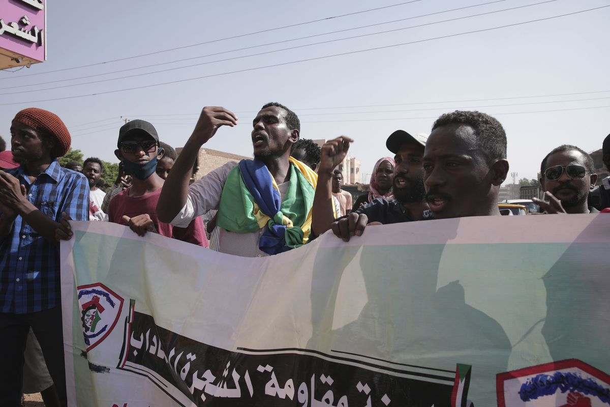 People chant slogans during a protest in Khartoum, amid ongoing demonstrations against a military takeover in Khartoum, Sudan, Thursday, Nov. 4, 2021. (Marwan Ali)