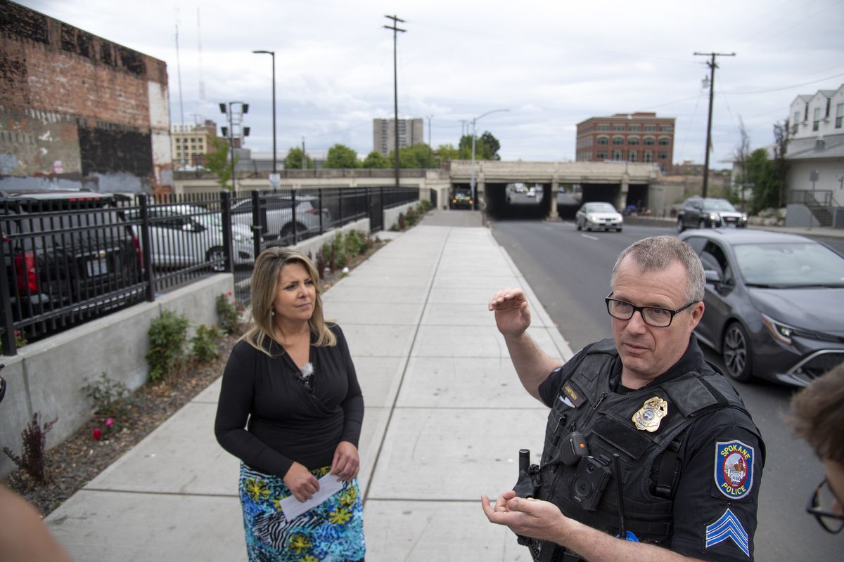 Mayor Nadine Woodward and Spokane police Sgt. Jason Hartman talk Wednesday with local media about the city’s clean-up plans for the Browne Street underpass.  (JESSE TINSLEY/THE SPOKESMAN-REVIEW)