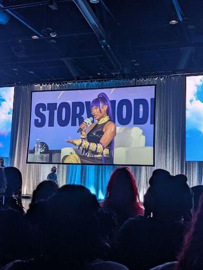 Megan Thee Stallion talks on stage at Dreamcon 2025.  (Brianna Fields/The Black Lens)
