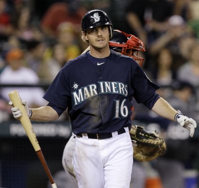 Josh Wilson of the Mariners strikes out to end the game. (Associated Press)