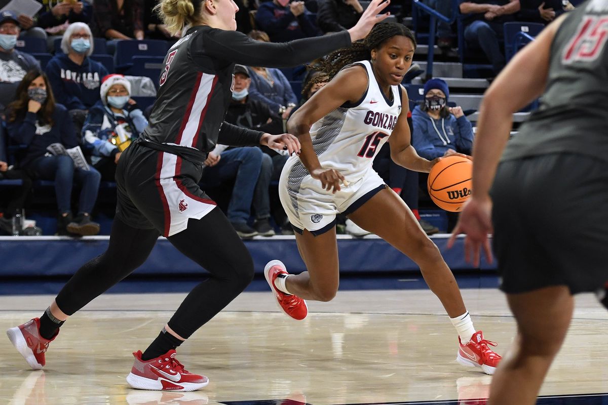 Gonzaga forward Yvonne Ejim (15) dribbles the ball as Washington State center Emma Nankervis (3) defends during an NCAA college basketball game, Wednesday, Dec. 8, 2021, in the McCarthey Athletic Center.  (COLIN MULVANY/THE SPOKESMAN-REVIEW)