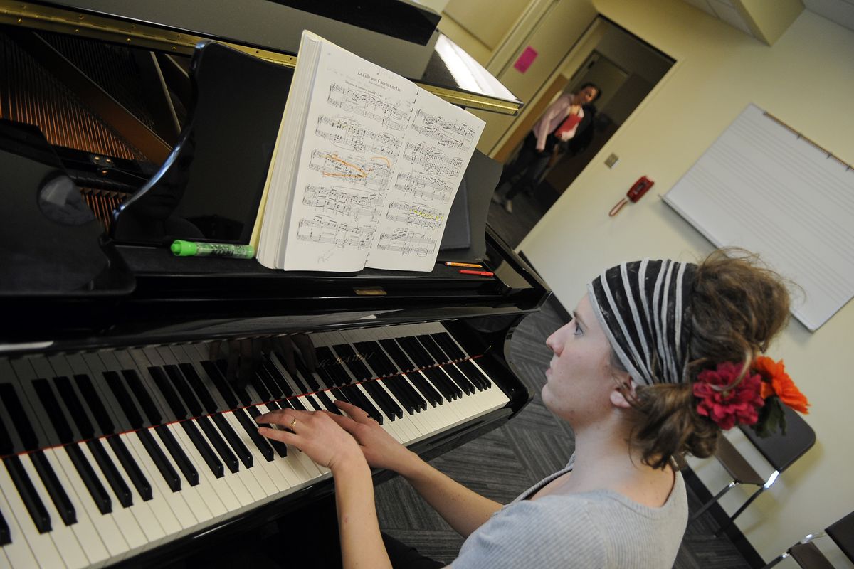 Spokane Falls Community College student Hillary Fisher plays the piano in the school’s newly renovated music building Tuesday. Her studio room features a spring-loaded floating floor for sound insulation. (Dan Pelle)
