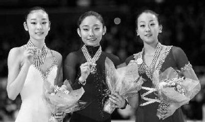 
Kim Yu-na (bronze), Miki Ando (gold) and Mao Asada (silver) display medals. 
 (Associated Press / The Spokesman-Review)