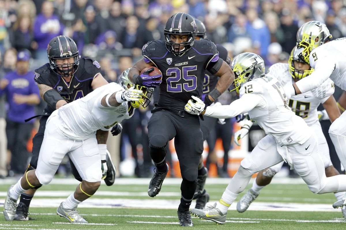Washington’s Bishop Sankey rushed for 167 yards, two touchdowns. (Associated Press)