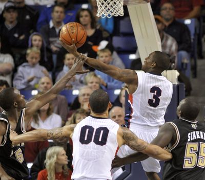 IUPUI's Alex Young (5) fouls Gonzaga's Demetri Goodson on his way to the basket in the second half Sunday, Nov. 14, 2010 in the McCarthey Athletic Center. (Colin Mulvany / The Spokesman-Review)
