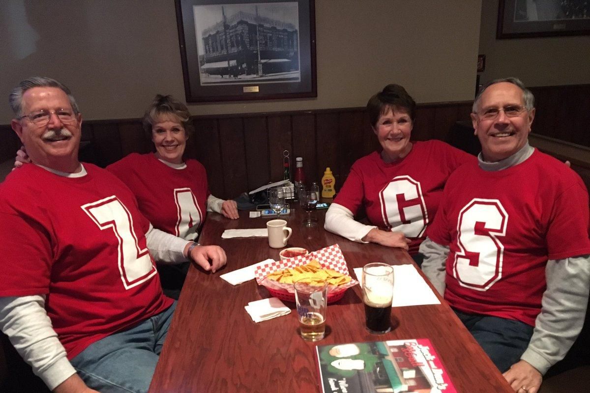 Gonzaga fans (from left) Ken Cross, Melba Cross, Judy Gering and Virg Gering celebrate the national championship game at Jack and Dan’s bar in Spokane on Monday, April 3, 2017. The group of retirees said they bought their matching shirts several years ago at a WCC Tournament game and planned on visiting several bars ahead of Monday night’s tipoff. (Kip Hill / The Spokesman-Review)