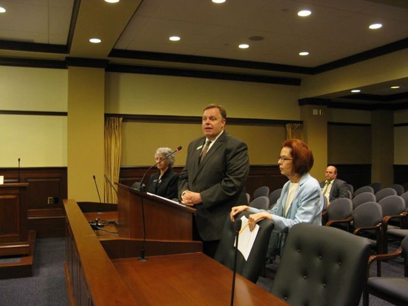 Wayne Hammon, center, Gov. Butch Otter's budget director, center, joins Reps. Anne Pasley-Stuart, D-Boise, right, and Elfreda Higgins, D-Garden City, left, to support HB 604 on Wednesday, with an amendment. The House Commerce & Human Resources Committee unanimously backed the move and sent the bill to the full House for amending. (Betsy Russell)
