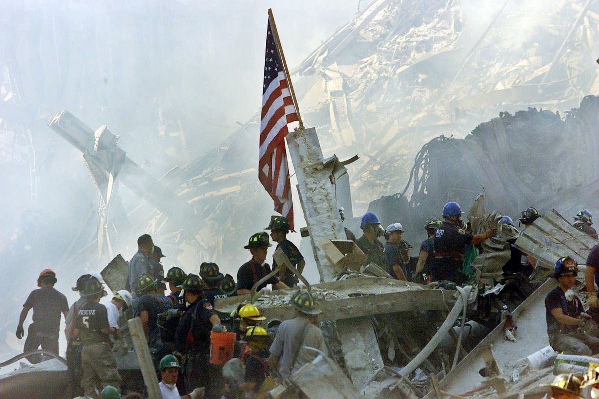 On Sept. 13, 2001, a U.S. flag flies over the rubble of the collapsed World Trade Center buildings in New York City. Experts say there may be nowhere else in the world where flags stir more intense feelings than in the United States. (Associated Press)