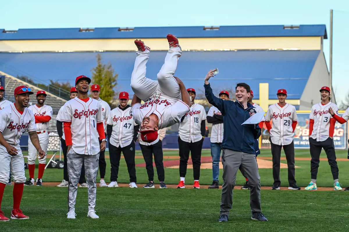 Spokane Indians utility player Colin Simpson performs a backflip to win $100.00 for the best player introduction from announcer Greg Talbot during the team’s Fan Fest event on April 6, 2022 at Avista Stadium.  (Colin Mulvany/The Spokesman-Review)