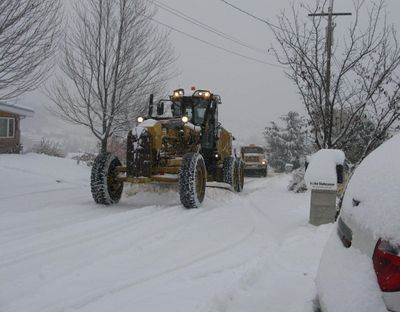 Road grader and sander clear snow from a route in the Boise foothills on Friday morning, amid a record snowstorm (Charlie Russell)