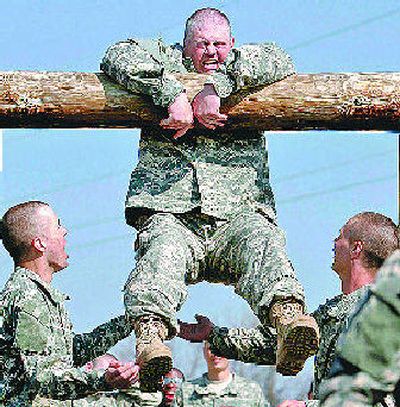 
 Larry Wall, 40, of Birmingham, Ala., tries to get through the confidence course in his second week of basic training at Fort Leonard Wood in Missouri. 
 (McClatchy-Tribune / The Spokesman-Review)