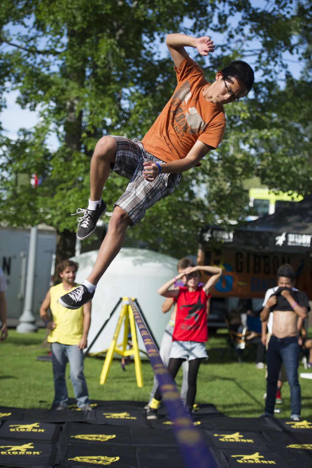 During warm-ups before the trick-run competition at the World Cup of Slacklining, Peter Chen of Fort Collins, Colo., performs a routine Thursday. The event was held during Hoopfest weekend in Riverfront Park. (Colin Mulvany)