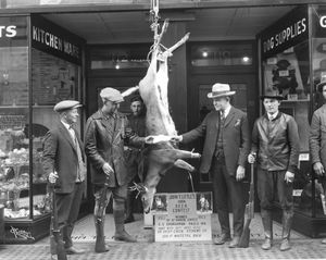 1924: John T. Little, in vested suit, hands a cash prize to a hunter in front of his store in downtown Spokane. The proprietor of John T. Little Hardware was an avid sportsman himself and his hardware store became a hub for hunters and fishermen. (Libby Collection/Eastern Washington Historical Society / SR)