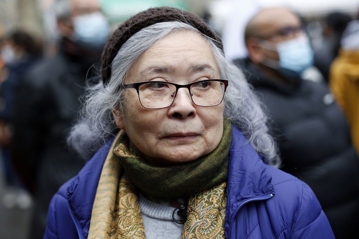 Tran To Nga, a 78-year-old former journalist, attends a gathering in support of people exposed to Agent Orange during the Vietnam War, in Paris, Saturday Jan. 30, 2021. Activists gathered Saturday in Paris in support of people exposed to Agent Orange during the Vietnam War, after a French court examined a case opposing a French-Vietnamese woman to 14 companies that produced and sold the toxic chemical. (Thibault Camus)
