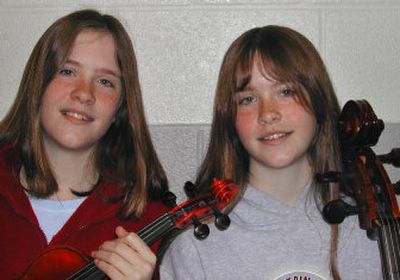 
 Jennifer, left, and Melissa Kersh are seventh-graders at Mountain View Middle School and have been performing with the Junior Orchestra for a year. Jennifer plays violin and Melissa plays cello. 
 (Photo by Jennifer Larue / The Spokesman-Review)