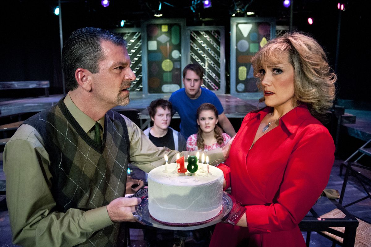 Mark Pleasant as Dan, left, and Heidi Santiago as Diana, in Spokane Civic Theatre’s production of “Next to Normal.” At rear, from left, are Mitch Heid as Henry, Robby French as Gabe, and Morgan Keene as Natalie. (Dan Pelle)