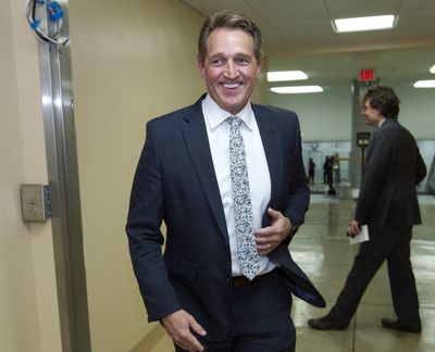 Sen. Jeff Flake, R-Ariz., walks to the senate chamber for early morning votes at Capitol Hill on Feb. 9, 2018 in Washington. Flake has a direct message for the Republicans of New Hampshire: Someone needs to stop Donald Trump. And Flake, a Republican senator from Arizona, may stand up against the Republican president in 2020, either as a Republican or an independent, if no one else does. (Jose Luis Magana / Associated Press)