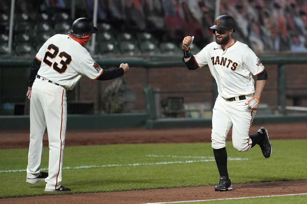 Evan Longoria of the San Francisco Giants hits a base loaded two-run