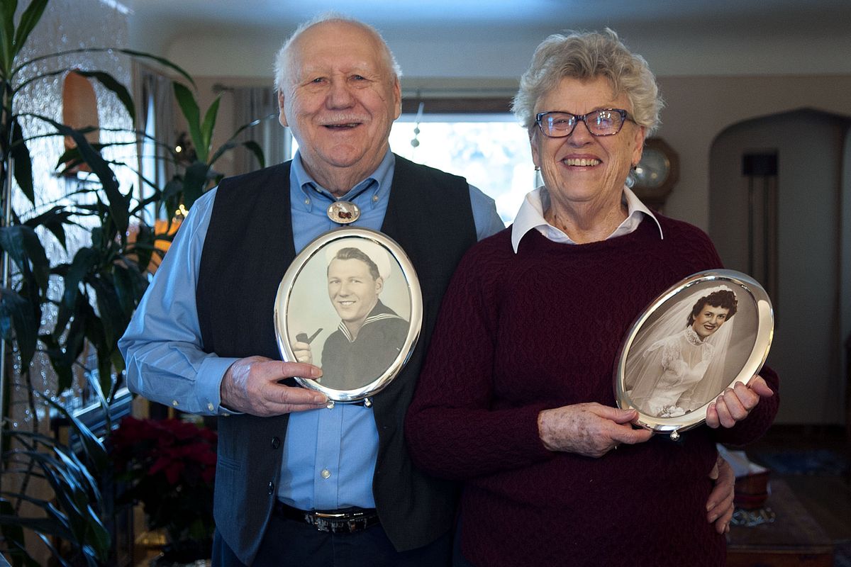 Bill and Donna Staeb hold photos of themselves taken in the 1950s at their home in Spokane on Dec. 30. (Kathy Plonka)