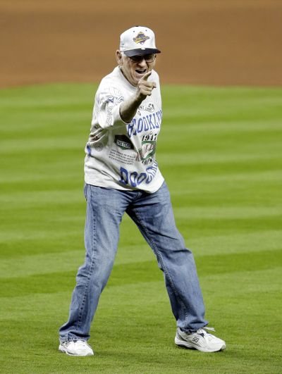 Jackie Robinson’s former ballboy, Norman Berman, throws first pitch in Miami. (Associated Press)