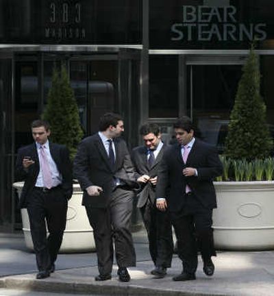 
Workers leave Bear Stearns in New York, the day a new agreement was announced that gave Bear Stearns Cos. shareholders five times the payout that was outlined in a JPMorgan Chase & Co. buyout deal a week earlier. Associated Press
 (Associated Press / The Spokesman-Review)