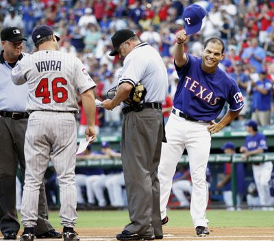 Newly re-acquired Ivan Rodriguez salutes the crowd. (Associated Press / The Spokesman-Review)