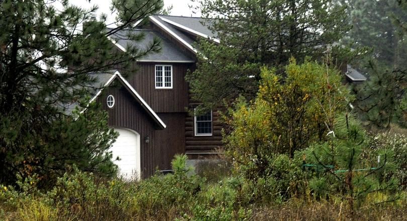 Idaho state Rep. Phil Hart's log home in Athol, Idaho, built partly with logs taken from state school endowment land (Kathy Plonka / SR file photo)