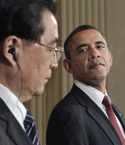 President Barack Obama and China's President Hu Jintao hold a  news conference  Wednesday.  (Associated Press)