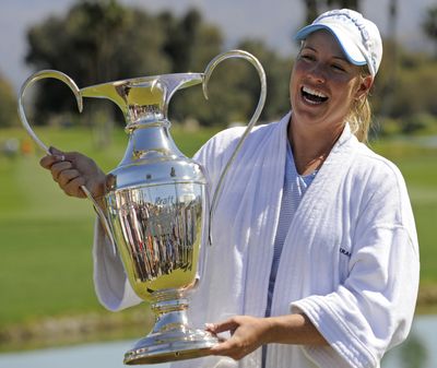 Brittany Lincicome poses with the champion’s trophy Sunday.  (Associated Press / The Spokesman-Review)