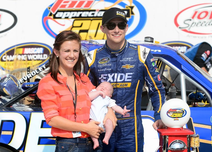James Buescher, driver of the #31 Exide Chevrolet, poses with wife Kris and son Stetson after winning the NASCAR Camping World Truck Series Fan Appreciation 200 presented by New Holland at Iowa Speedway on September 8, 2013 in Newton, Iowa. (Photo Credit: Jennifer Stewart/NASCAR via Getty Images) (Jennifer Stewart / Nascar)